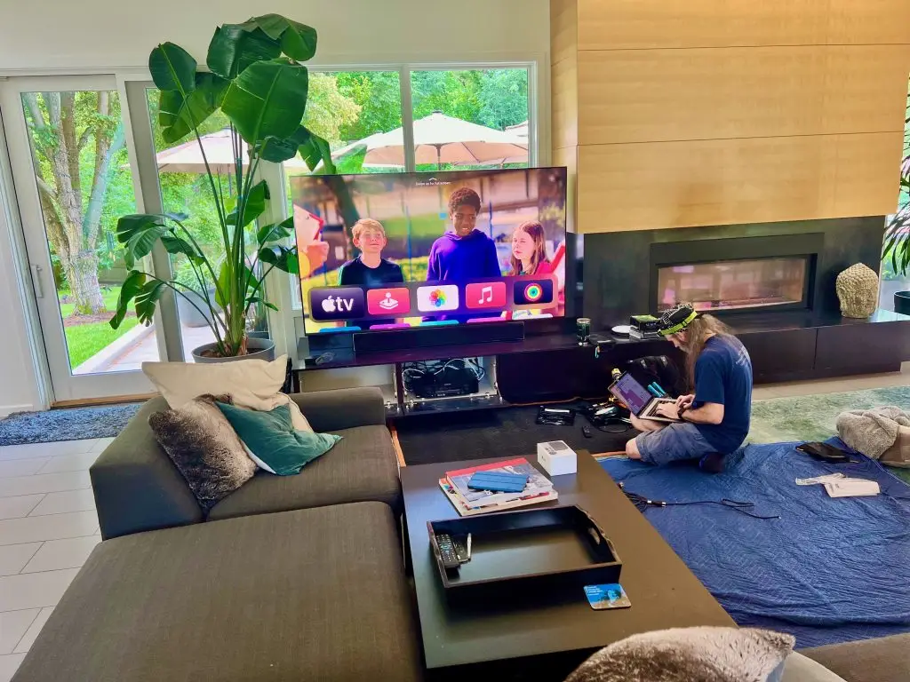 Why Can’t I Find Any Professionals to Help Me Install the Technology I Purchased Myself? 1 System programmer setting up a Savant home automation system with an 85-inch Sony OLED TV in a Prairie Village, KS, living room