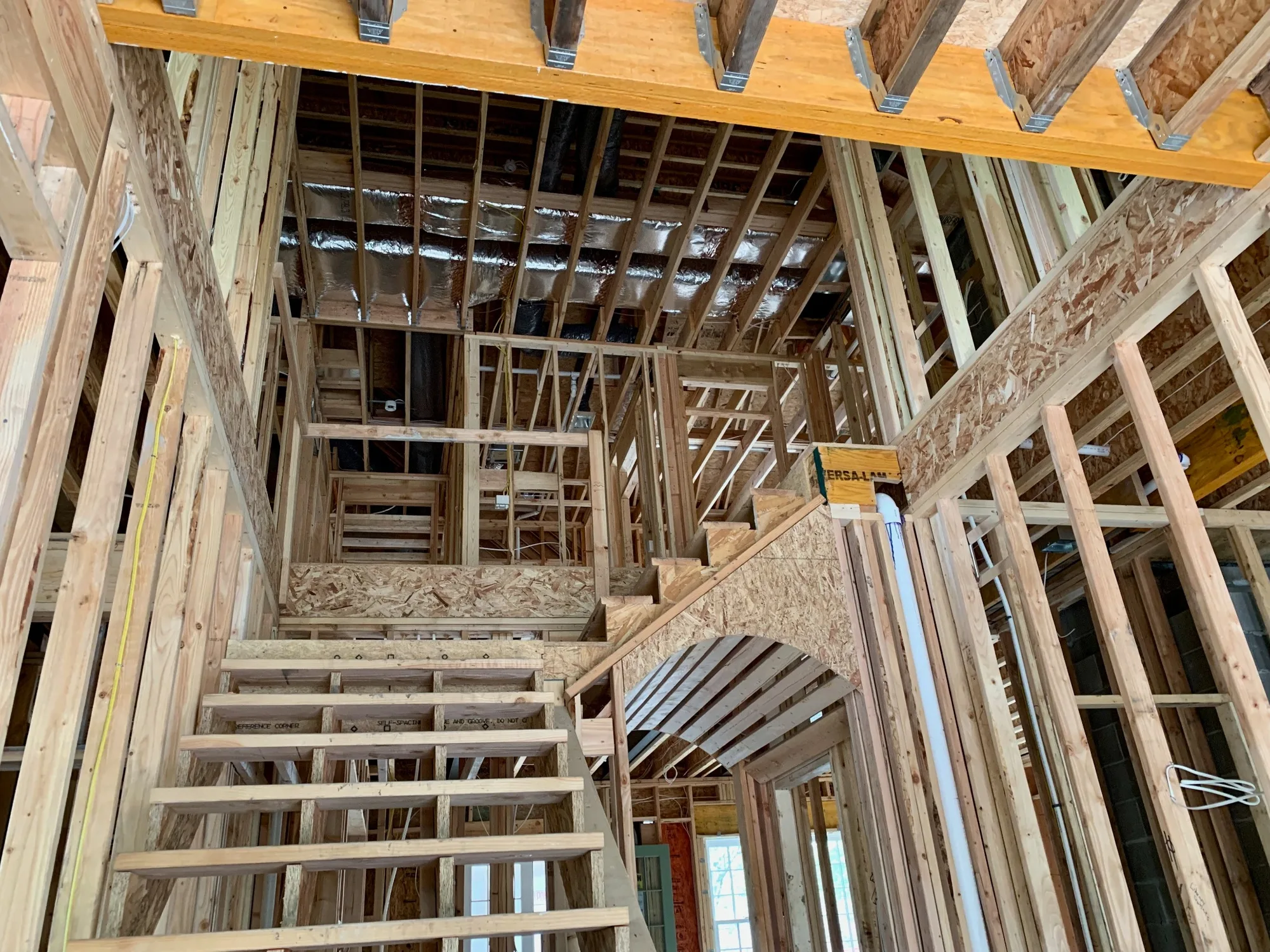 Blog 3 New home construction before drywall, highlighting the ideal stage for prewiring and technology planning